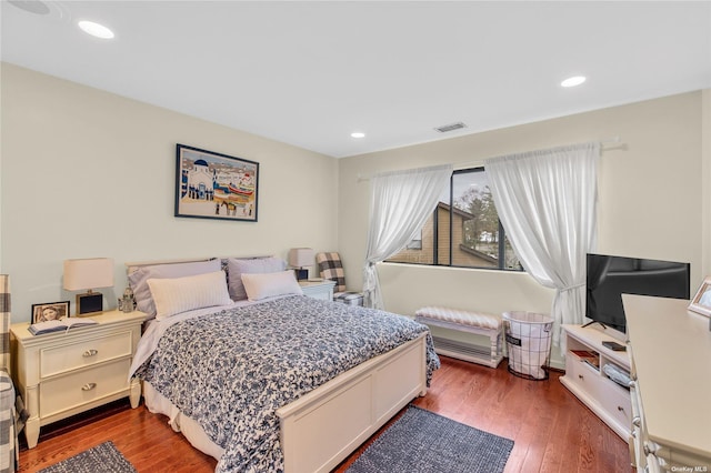 bedroom featuring dark wood-type flooring