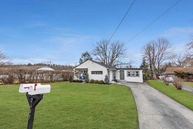 single story home featuring a front yard and a porch