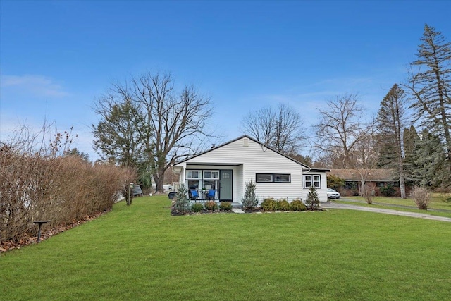 view of front of home with a front lawn