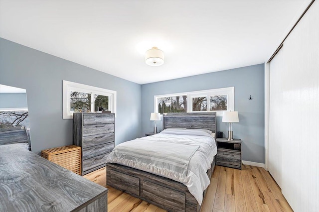 bedroom with light wood-type flooring