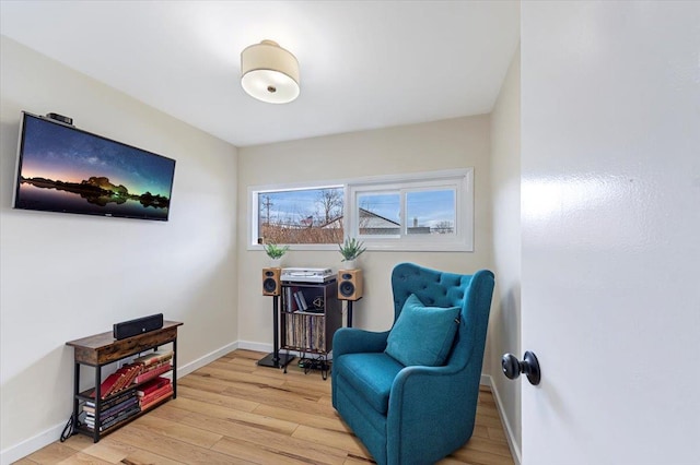 sitting room featuring light hardwood / wood-style flooring