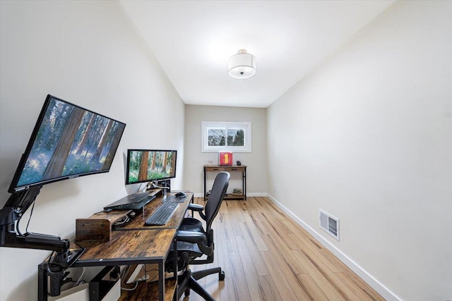 office area with light hardwood / wood-style flooring