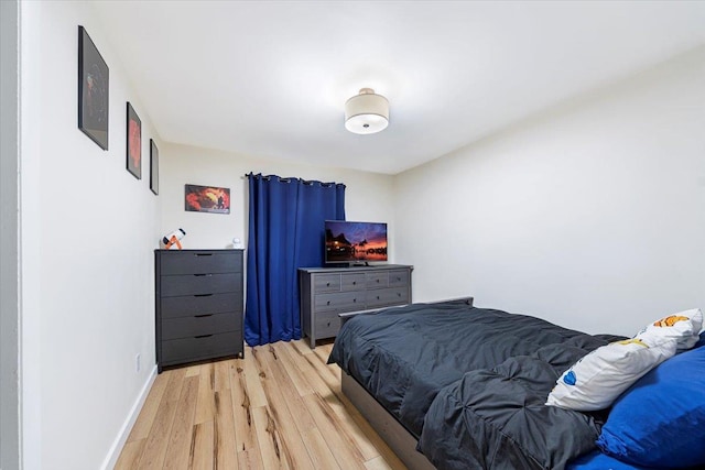 bedroom with light wood-type flooring