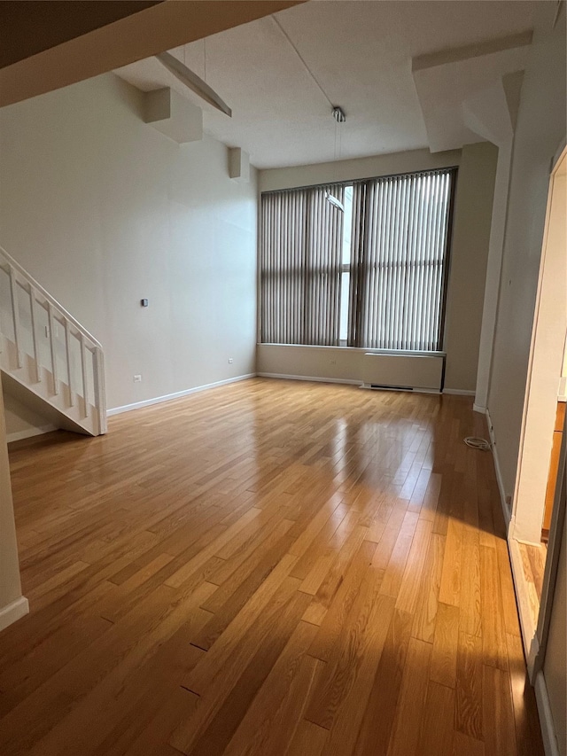 spare room featuring light hardwood / wood-style floors