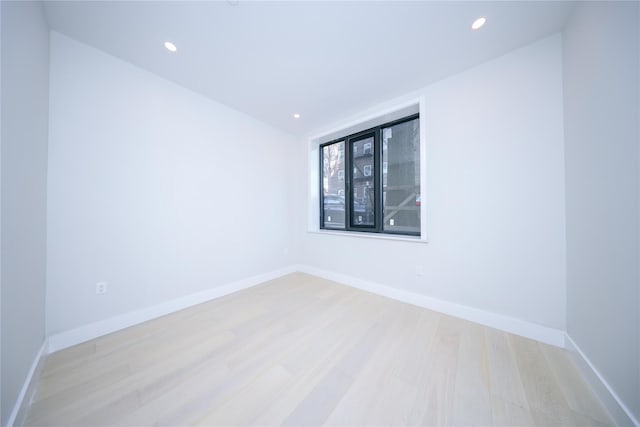 unfurnished room with light hardwood / wood-style flooring