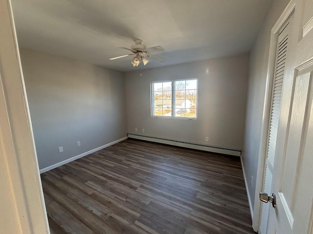 unfurnished bedroom featuring a baseboard radiator, dark hardwood / wood-style floors, and ceiling fan