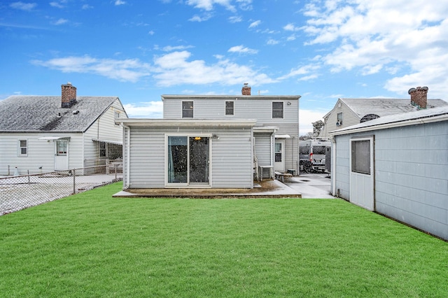 rear view of house with a yard, a patio, and central air condition unit