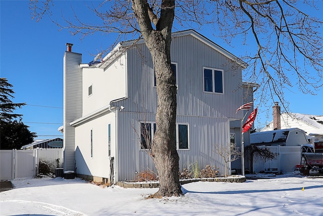 view of snow covered house