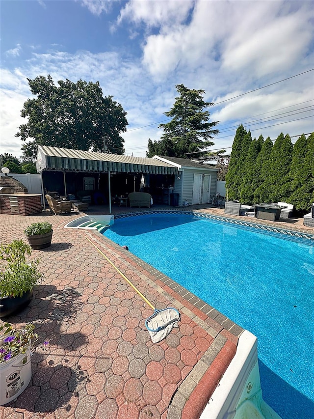 view of swimming pool featuring a patio area