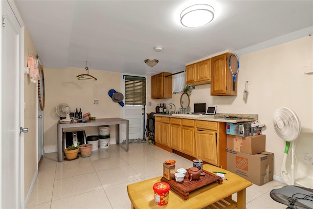 kitchen with light tile patterned flooring