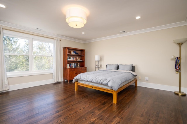 bedroom with dark hardwood / wood-style floors and crown molding