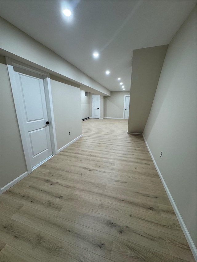 basement with light wood-type flooring