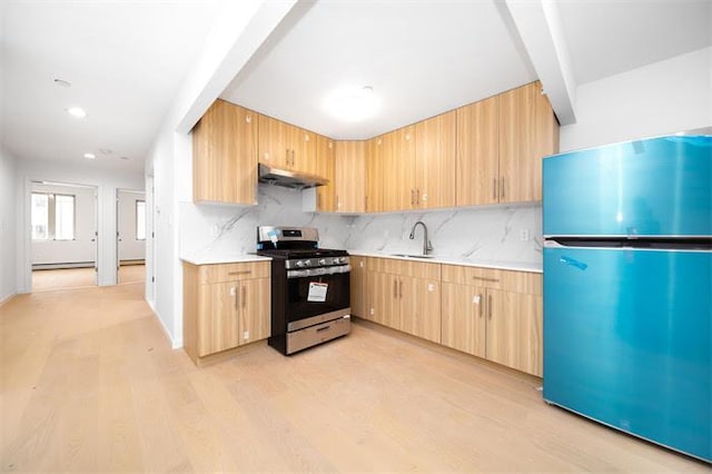 kitchen featuring light brown cabinets, ventilation hood, sink, light hardwood / wood-style flooring, and stainless steel appliances