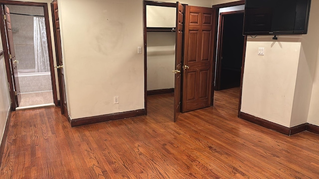 unfurnished bedroom featuring hardwood / wood-style flooring