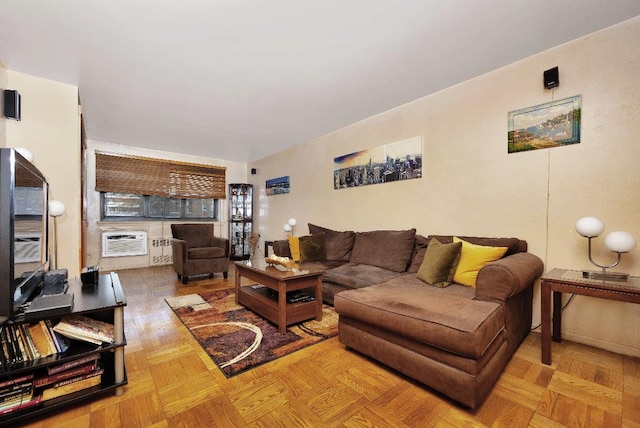 living room with a wall unit AC and parquet floors