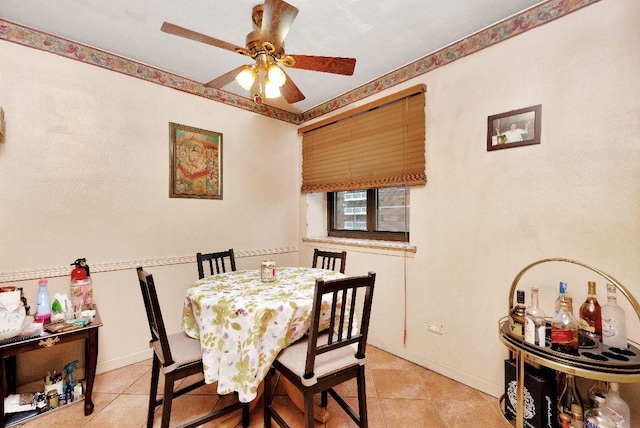 dining area featuring ceiling fan and light tile patterned floors