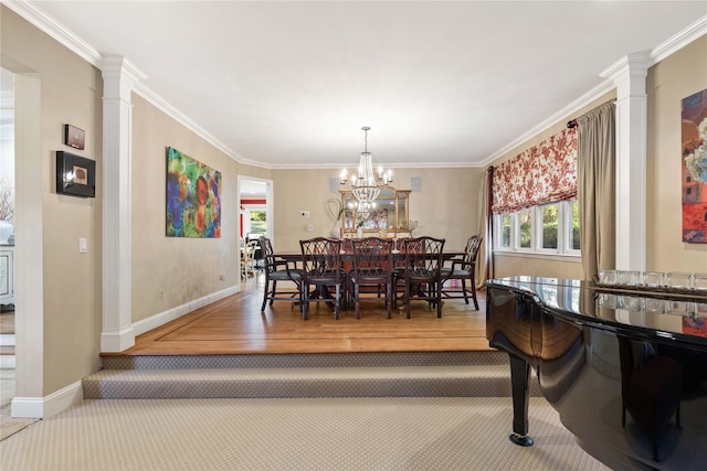 dining room with decorative columns, baseboards, a chandelier, and crown molding