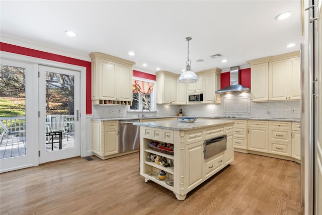 kitchen featuring pendant lighting, wall chimney range hood, cream cabinets, black appliances, and open shelves