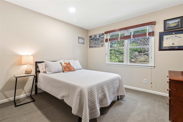 carpeted bedroom with baseboards