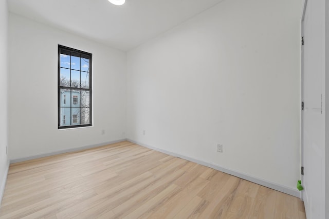 unfurnished room featuring light hardwood / wood-style floors