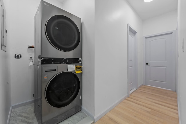 laundry area with stacked washer / drying machine