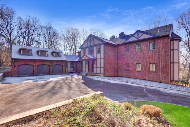 tudor home featuring a garage