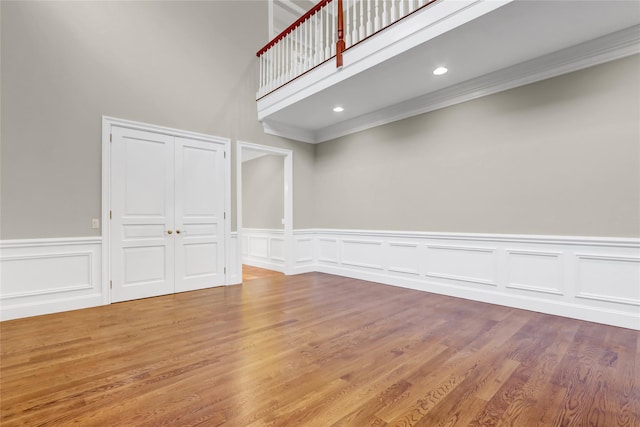 interior space featuring crown molding and hardwood / wood-style floors