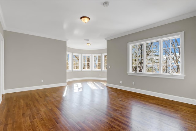 unfurnished room with dark wood-type flooring and ornamental molding