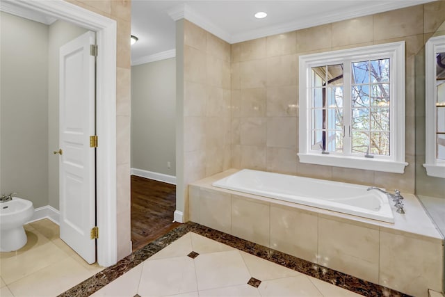 bathroom featuring a bidet, crown molding, tile patterned floors, and tiled bath