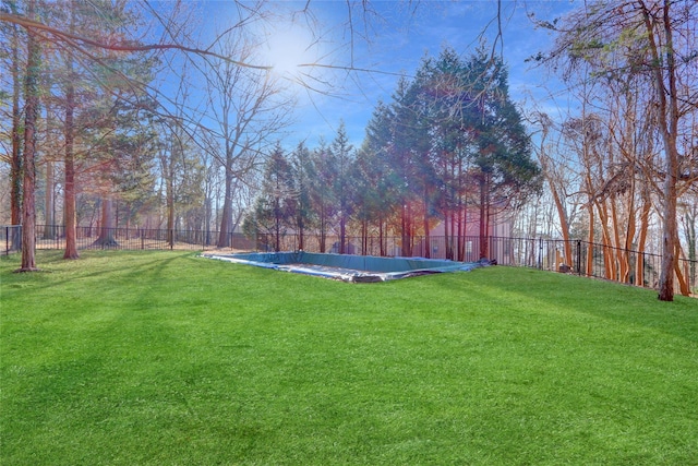 view of yard with a covered pool