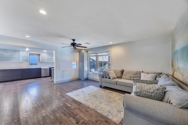 living room featuring ceiling fan and wood-type flooring