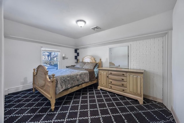 bedroom featuring a baseboard heating unit