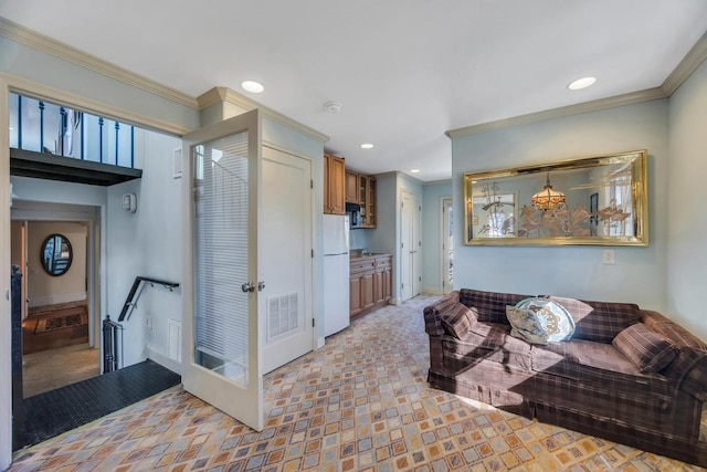 living room featuring crown molding
