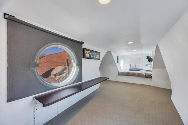 carpeted bedroom featuring vaulted ceiling