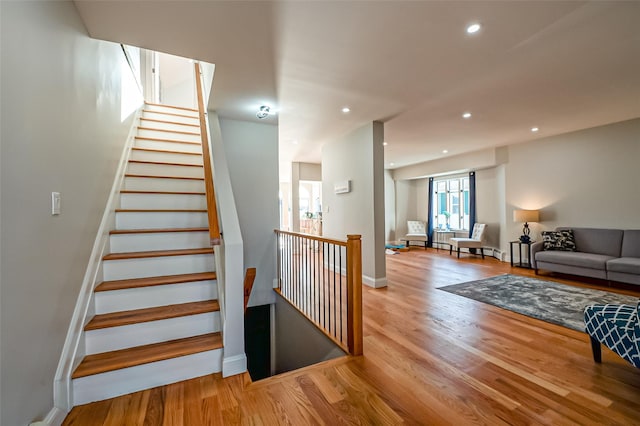 stairway featuring hardwood / wood-style floors