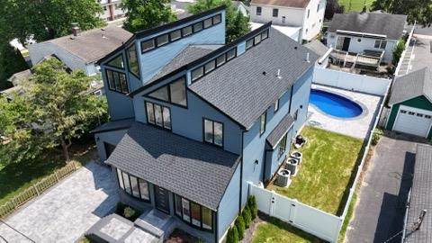 2726 Clarendon Ave, Bellmore, NY 11710 - view from above of property with a pool area