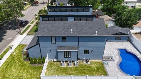2726 Clarendon Ave, Bellmore, NY 11710 - rear view of house featuring a fenced backyard and a patio