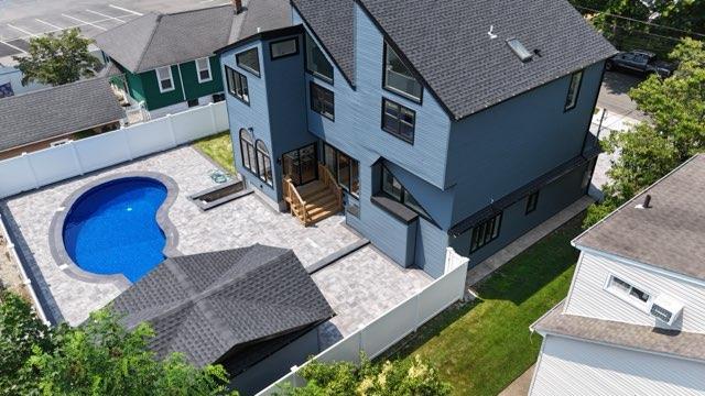 2726 Clarendon Ave, Bellmore, NY 11710 - aerial view of property and surrounding area with a pool area