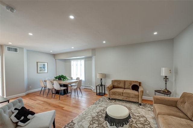 2726 Clarendon Ave, Bellmore, NY 11710 - living area with recessed lighting, light wood-style flooring, and baseboard heating