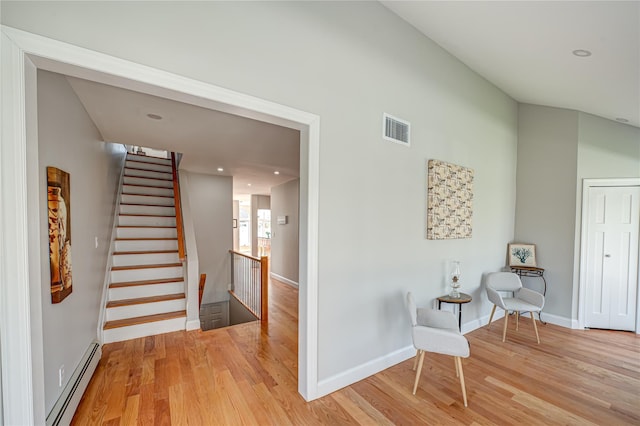 2726 Clarendon Ave, Bellmore, NY 11710 - living area with baseboard heating and light wood-style flooring