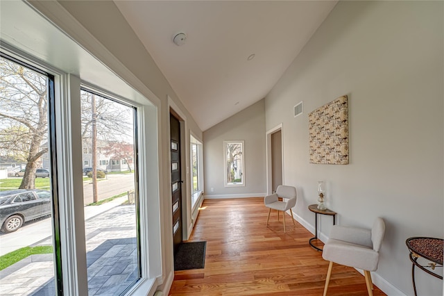2726 Clarendon Ave, Bellmore, NY 11710 - entrance foyer with plenty of natural light, light wood finished floors, and high vaulted ceiling