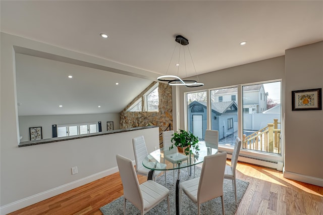2726 Clarendon Ave, Bellmore, NY 11710 - dining area featuring light wood-style floors, baseboard heating, vaulted ceiling, and recessed lighting