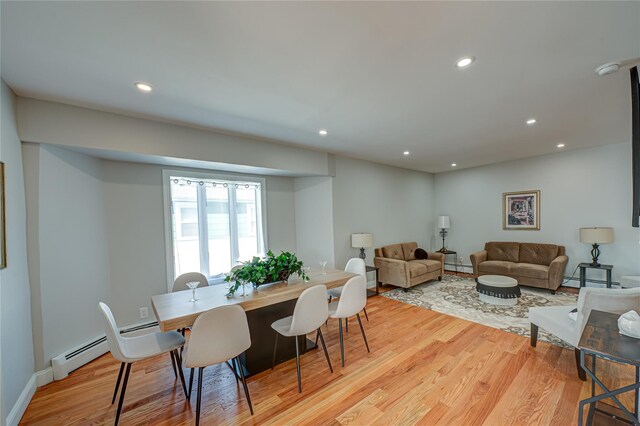 2726 Clarendon Ave, Bellmore, NY 11710 - dining room featuring light wood-style floors, baseboard heating, and recessed lighting