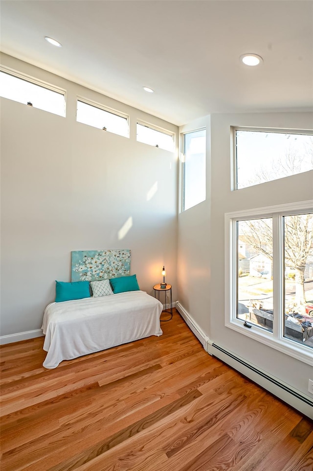2726 Clarendon Ave, Bellmore, NY 11710 - bedroom with wood finished floors and recessed lighting