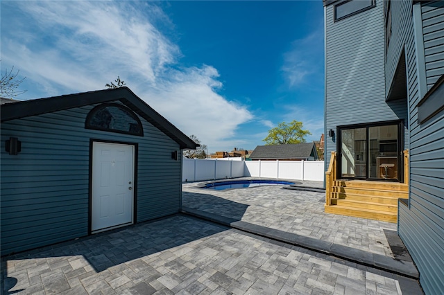 2726 Clarendon Ave, Bellmore, NY 11710 - fenced backyard featuring entry steps, a patio, and an outdoor structure