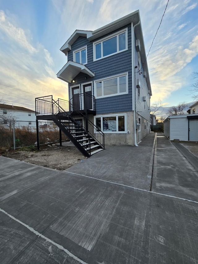 view of front facade with a storage shed