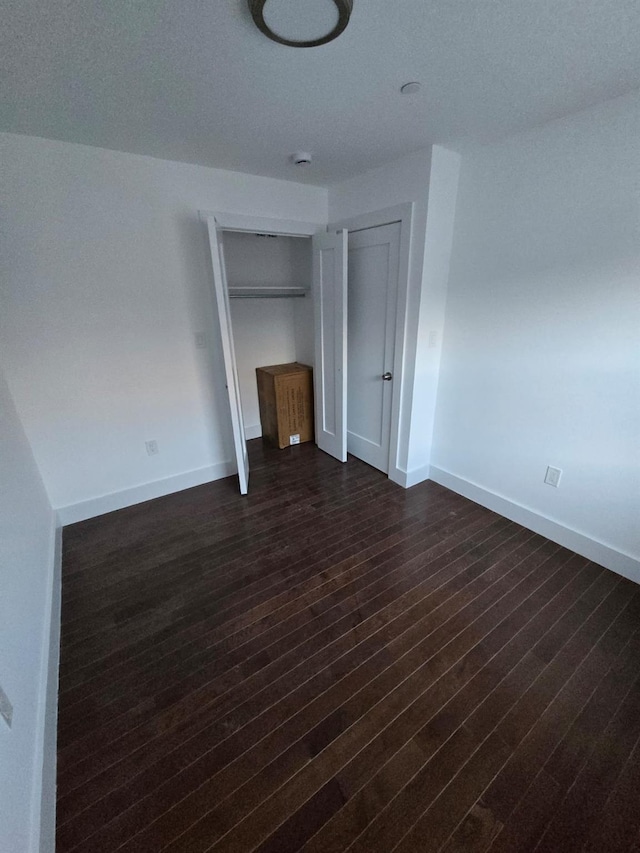 531 Bch 72nd St, Arverne, NY 11692 - unfurnished bedroom with dark wood finished floors and baseboards