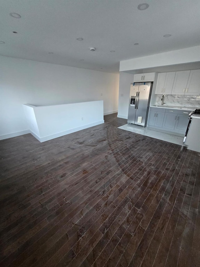 531 Bch 72nd St, Arverne, NY 11692 - kitchen with stainless steel refrigerator with ice dispenser, dark wood finished floors, open floor plan, white range with gas cooktop, and light countertops