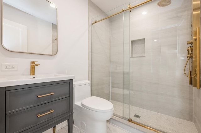 bathroom featuring walk in shower, vanity, and toilet