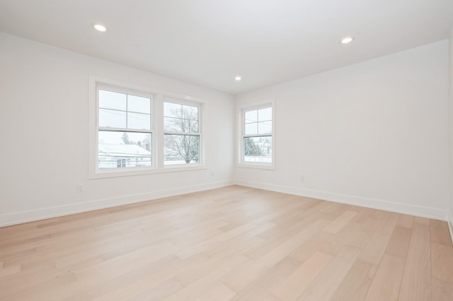 empty room with light hardwood / wood-style floors